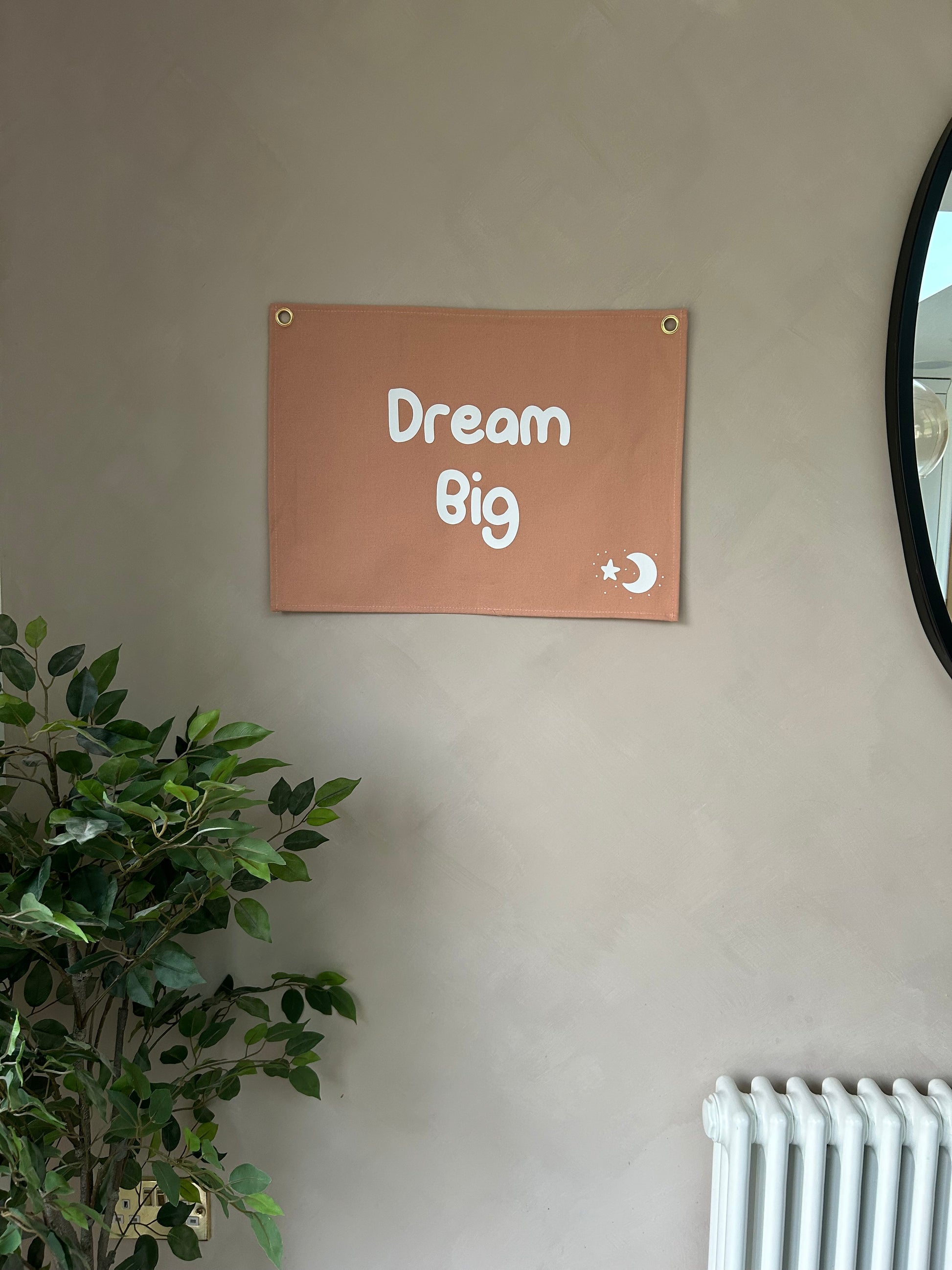 dusty pink wall flag with dream big on it