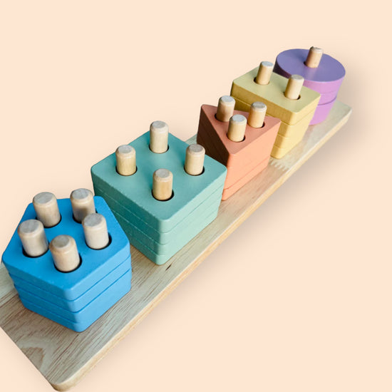 wooden stacker toy with different colours and shapes