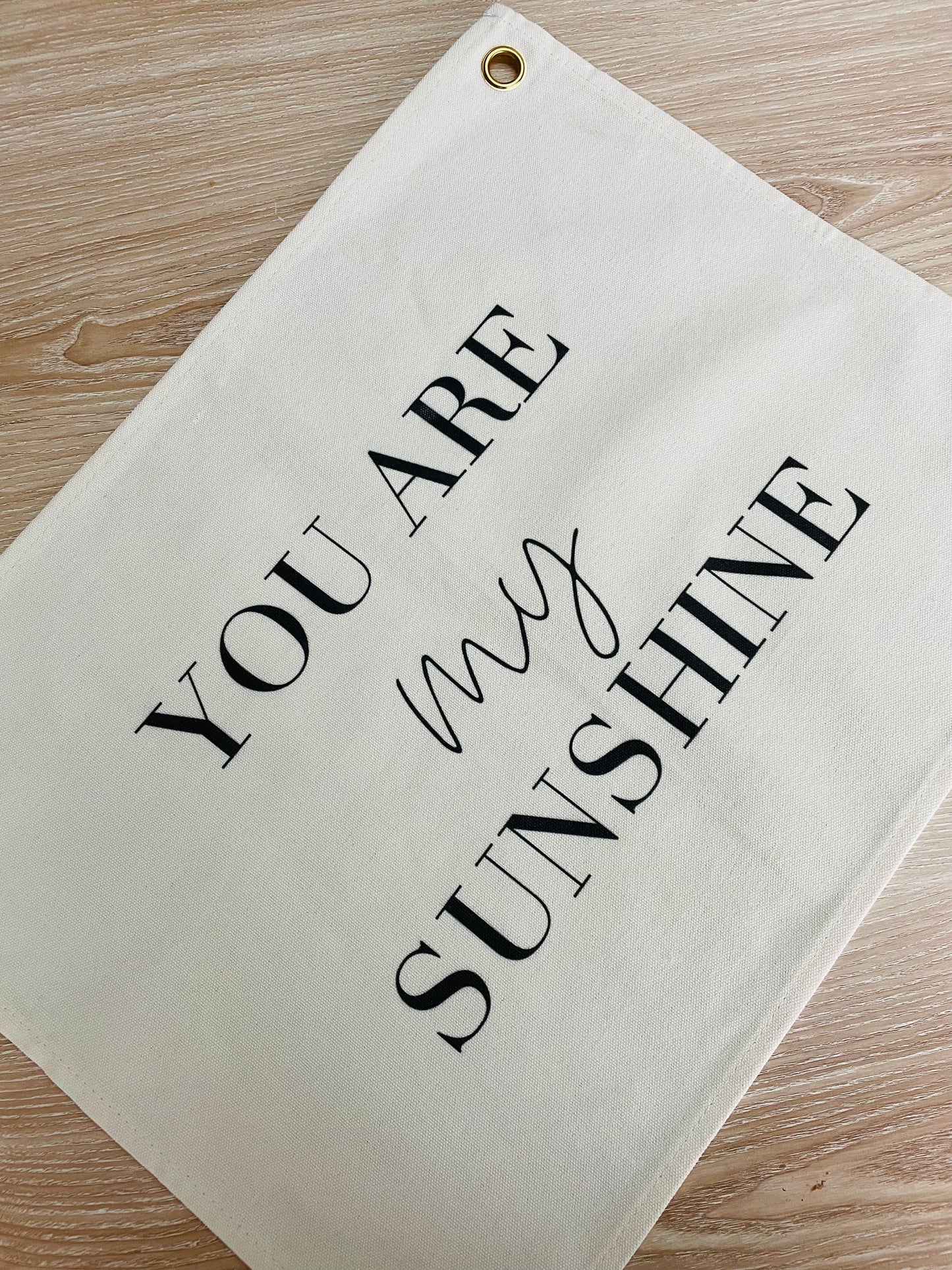 wall flag with your are my sunshine written on it